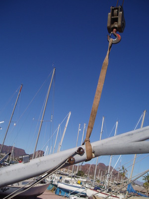 Mast in crane sling being hoisted above deck