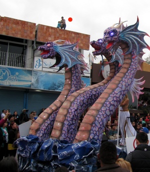 Mom and kid dancing on roof, watching the parade