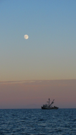 Fishing boat in moonlight at Santa Barbara