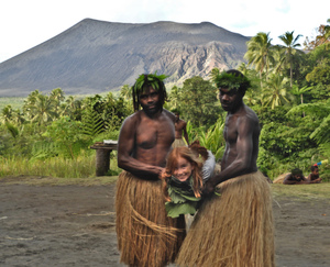 Girl supported on an improvised stretcher made from large plant leaves.