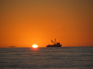 Sunset in Mag Bay with Fishing boat in foreground